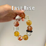 east rise|solar plexus chakra vitalizing|negative energy dispelling|vitality & luck boost|purple auspicious blessing|warm sunny texture|multi crystal energy interweaving|positive fortune empowerment